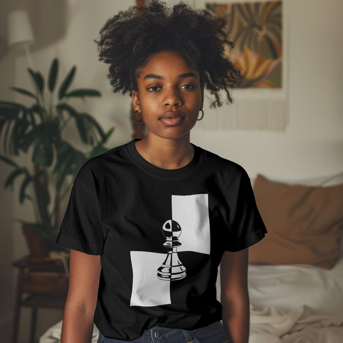Girl wearing a black t-shirt with a pawn chess piece graphic