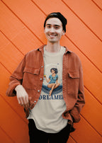 Person wearing a shirt with a graphic design and text against an orange wall