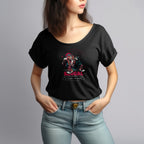 Person wearing a black t-shirt with a colorful graphic design on a gray background