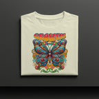 Folded t-shirt with a colorful butterfly design and 'GROWTH' text on a dark background