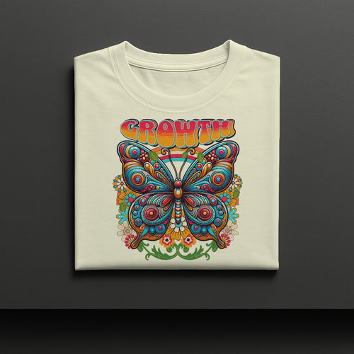 Folded t-shirt with a colorful butterfly design and 'GROWTH' text on a dark background
