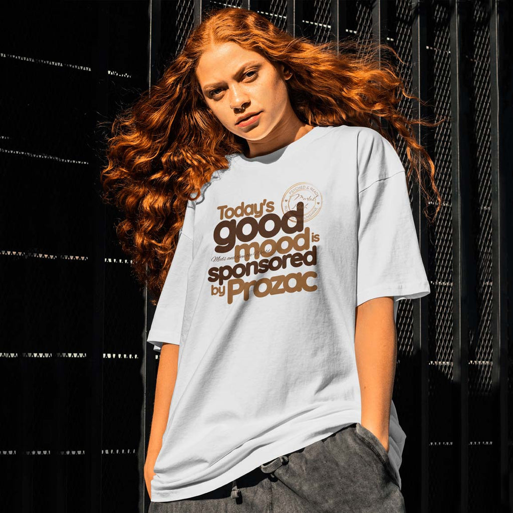 Person wearing a t-shirt with text in front of a black background
