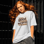 Person wearing a t-shirt with text in front of a black background