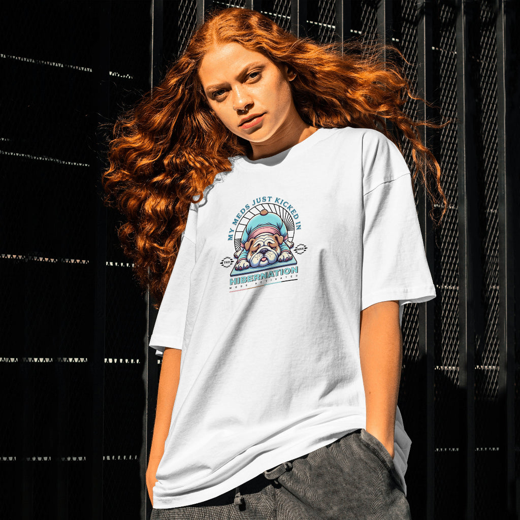Person wearing a white t-shirt with a graphic design against a black background