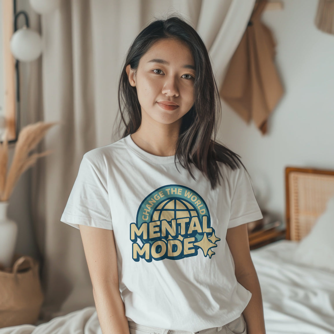 Woman wearing a white t-shirt with 'Change the World Mental Mode' design in a bedroom setting