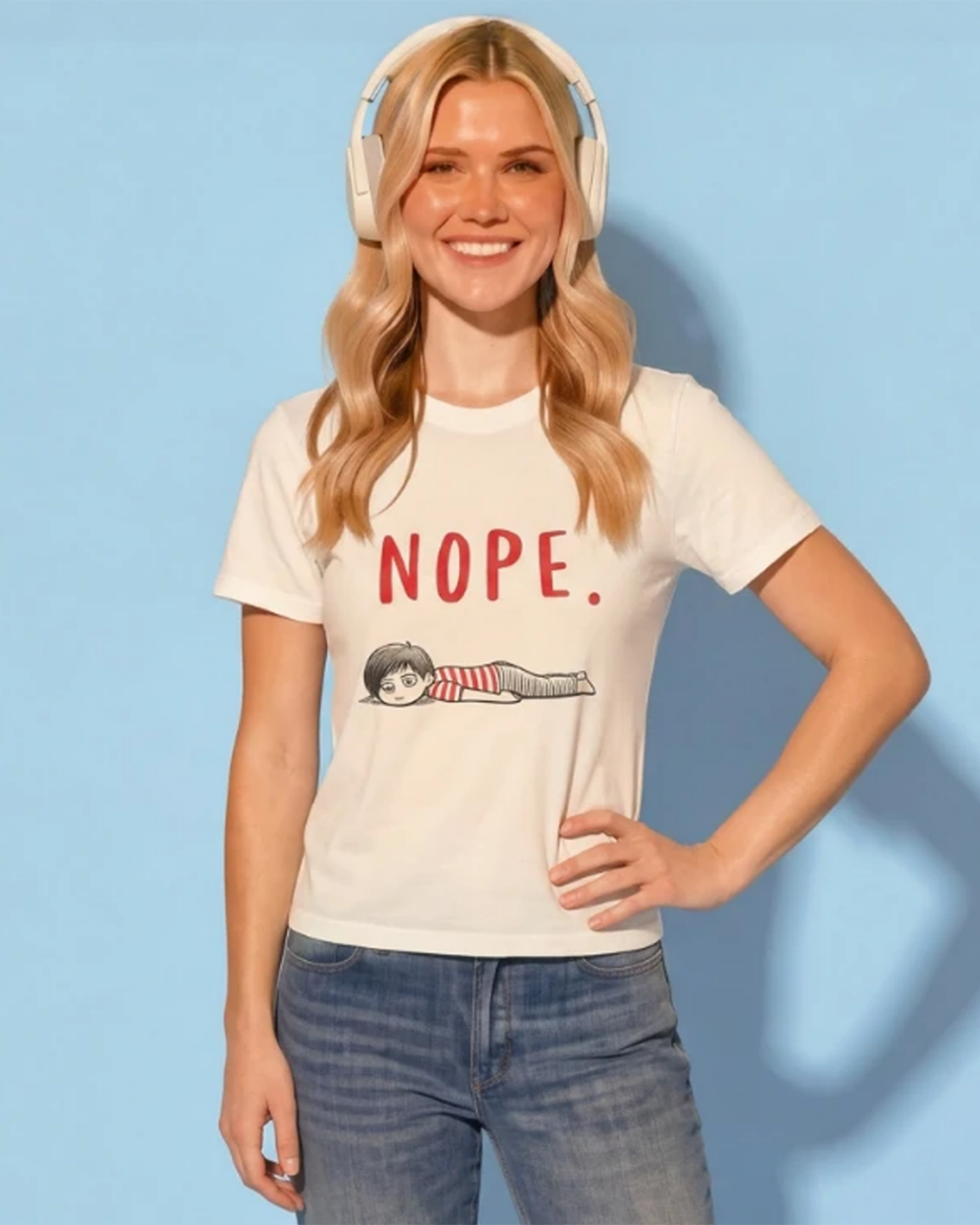 Woman wearing a white t-shirt with 'NOPE.' text and graphic, standing against a light blue background