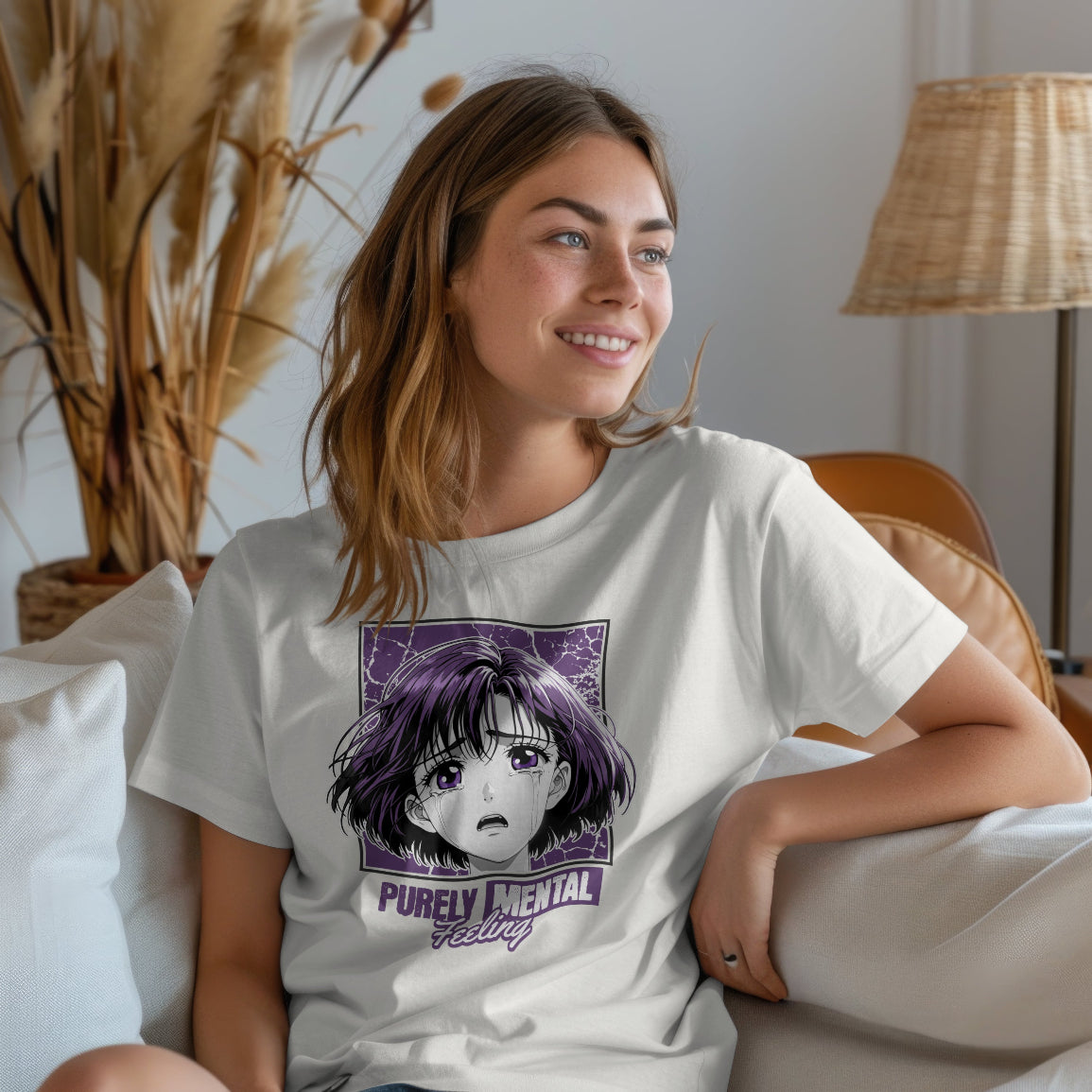 Woman wearing a white t-shirt with a Purely Mental graphic design sitting on a couch.