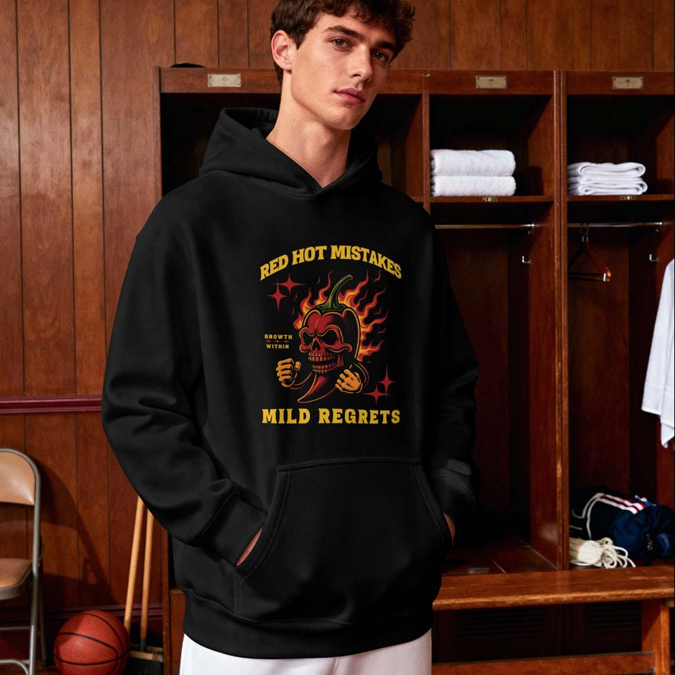 Person wearing a black hoodie with a graphic design in a locker room.