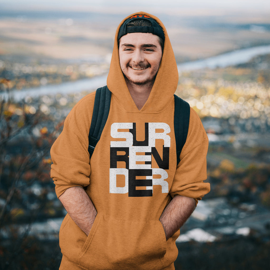 Person wearing an orange hoodie with 'SURF ENDER' text, standing outdoors with a scenic background.