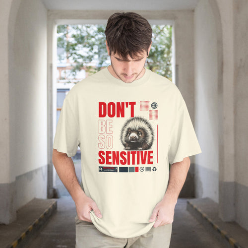 Person wearing a t-shirt with a graphic and text in an indoor setting