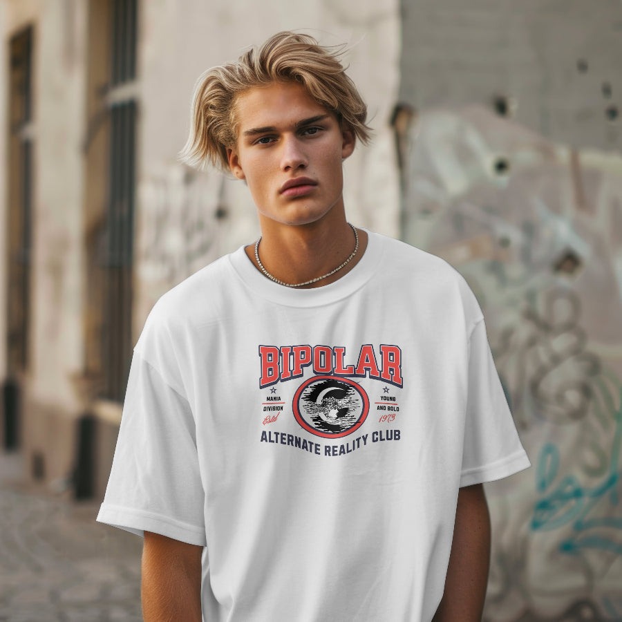 Person wearing a white t-shirt with 'Bipolar' graphic design in an urban setting
