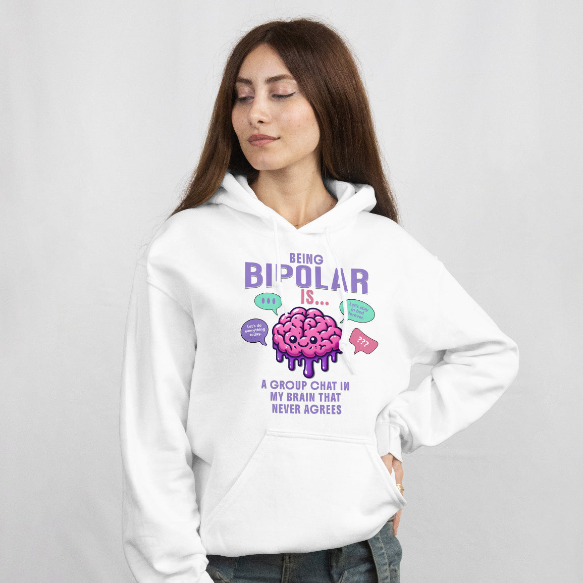 Person wearing a white hoodie with a funny saying about being bipolar graphic and text on a plain background