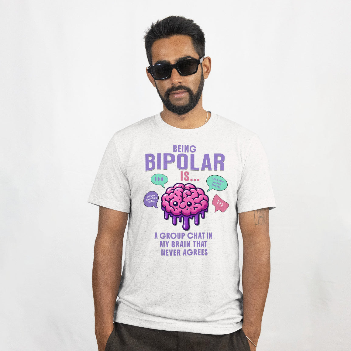 Man wearing a t-shirt with a colorful graphic of a bipolar brain and text about bipolar disorder on a white background