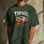 Person wearing a green t-shirt with a graphic design and text.